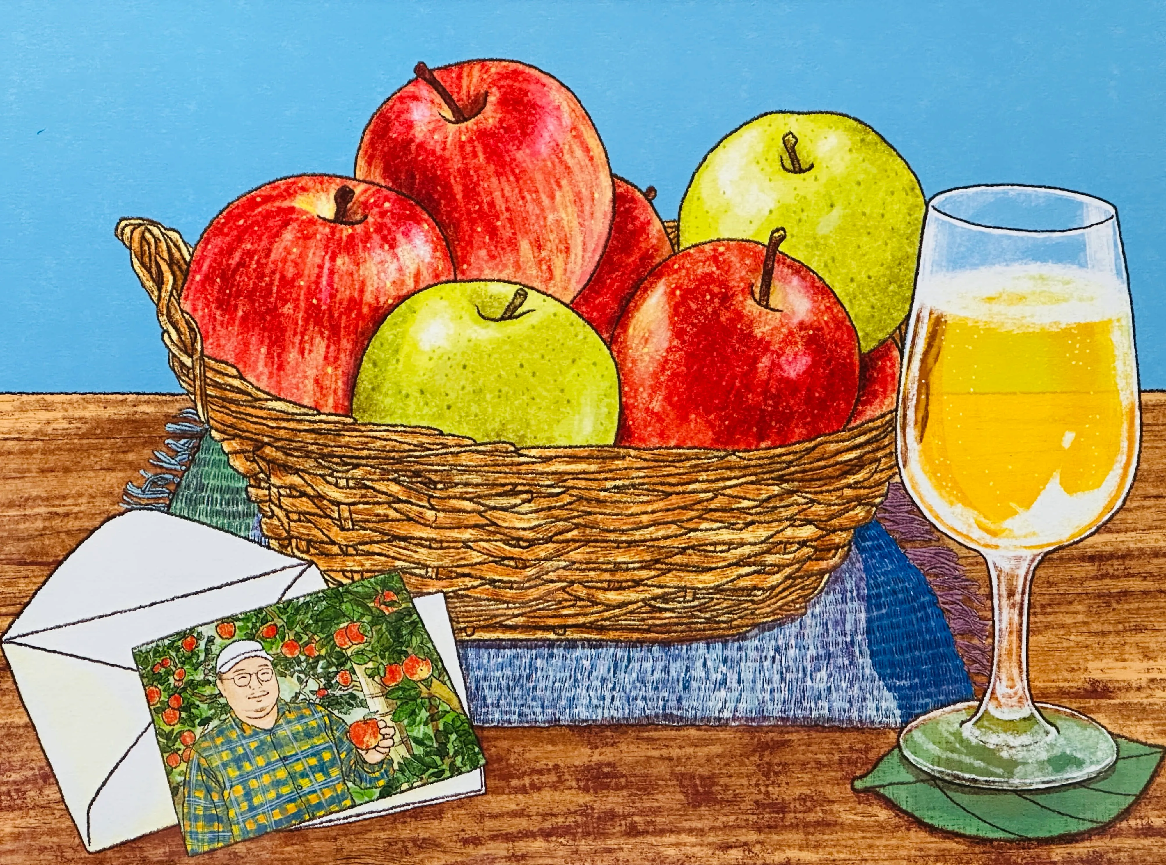 梵珠のもつけんどのメンバーでトキあっぷる社の代表 土岐彰寿をイメージした絵。描いたのはイラストレータの唐仁原多里さん。土岐が育てたサンふじと王林、そしてこれらのリンゴから作ったシードルが描かれてます。唐仁原さんが手がける2025年のカレンダー、10月のイラストになっています。