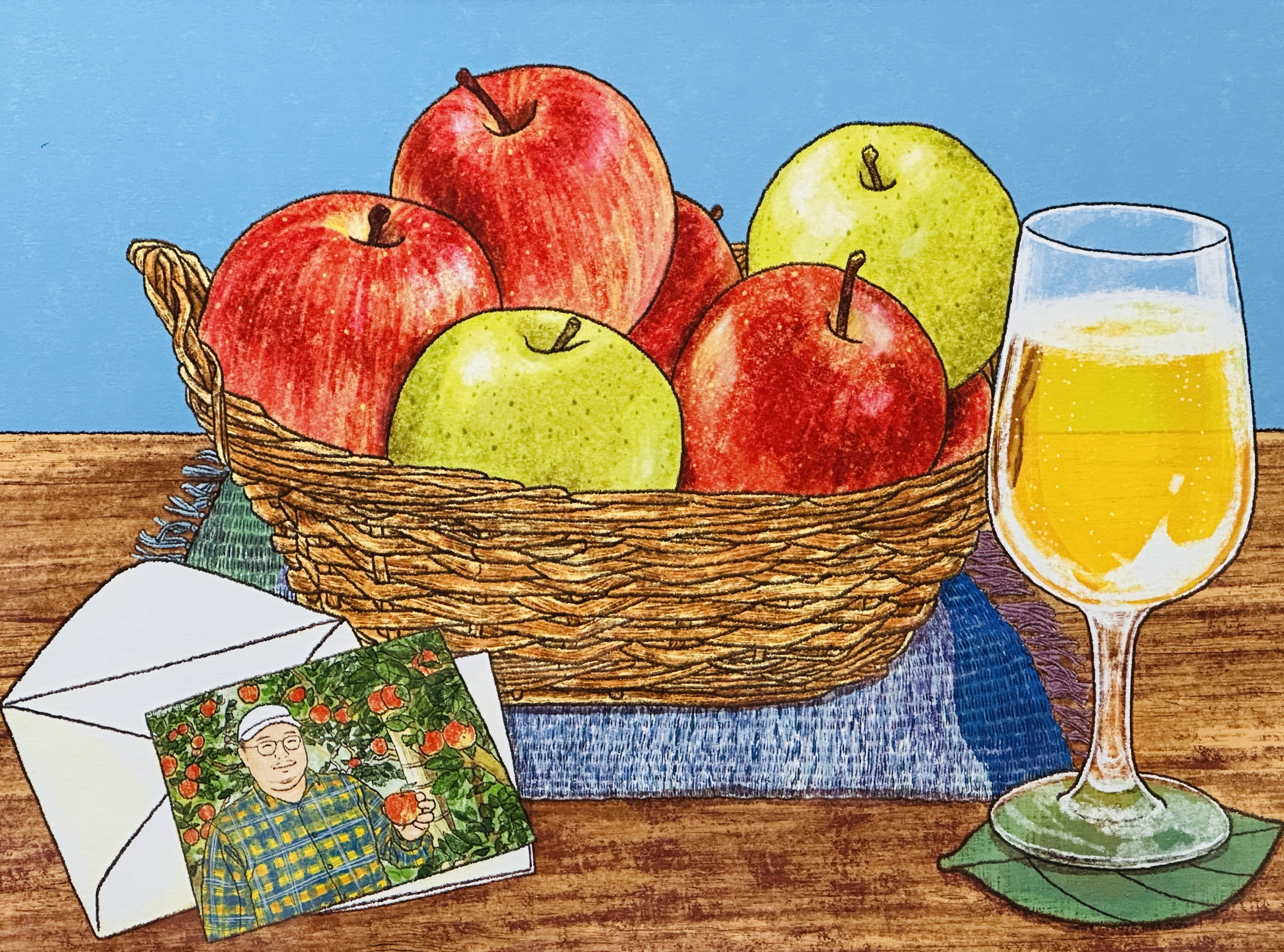 梵珠のもつけんどのメンバーでトキあっぷる社の代表 土岐彰寿をイメージした絵。描いたのはイラストレータの唐仁原多里さん。土岐が育てたサンふじと王林、そしてこれらのリンゴから作ったシードルが描かれてます。唐仁原さんが手がける2025年のカレンダー、10月のイラストになっています。